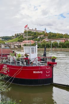 Wuerzburg, Germany – September 27, 2024: the Main Kutter, a popular restaurant on a ship on the River Main near Wurzburg
