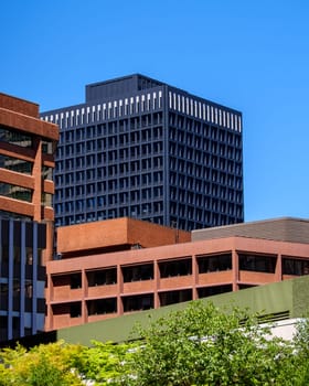 Architecture of modern buildings on blue sky background in downtown of Vancouver, Canada.