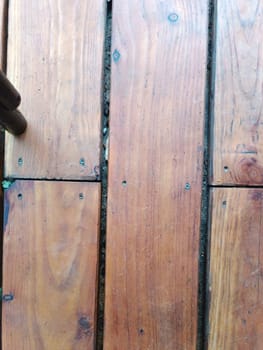 Weathered old wooden planks with visible grain patterns rustic inside interior texture background floor home . High quality photo