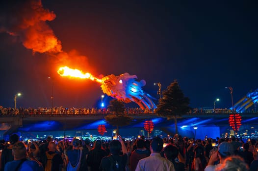 Fire show with flame on Dragon Bridge or Cau Rong Bridge in Da Nang in Vietnam in Asia at night. Da Nang, Vietnam - November 29, 2024