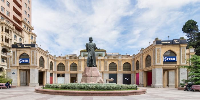 Baku, Azerbaijan - May 5, 2024: The Nasimi Monument prominently features a statue of the celebrated Azerbaijani poet, Nasimi, perched atop a granite pedestal