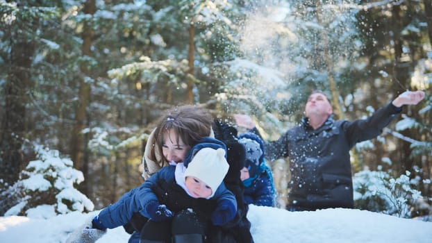 Family enjoying a joyful winter day in a snowy forest, playing together and creating cherished memories filled with laughter and warmth