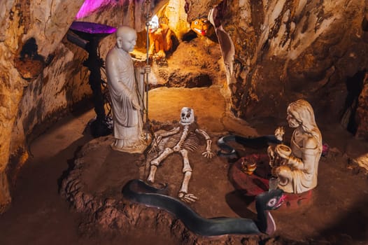 A creepy scene from hell in the Am Phu Cave in the Marble Mountains in Da Nang, Vietnam, Asia