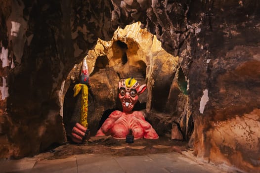 A creepy monster in the Am Phu Cave in the Marble Mountains in Da Nang, Vietnam, Asia