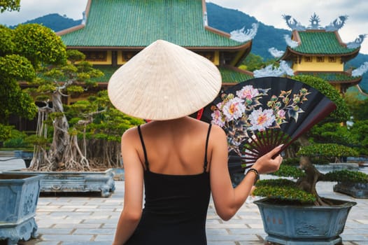 woman tourist traveler at Buddhist temple at the Linh Ung Pagoda in Da Nang in Vietnam. Concept of travel and tourism in Asia
