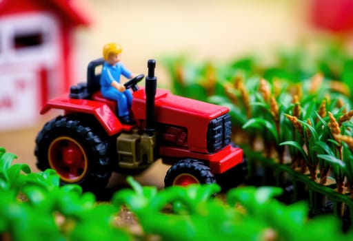 Small toy tractor with driver figure