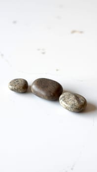 close up of a group of pebbles on a white background