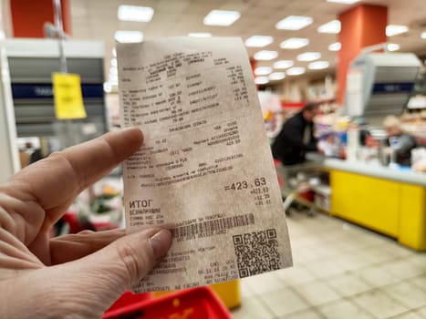 Ulan-Ude, Russia - November 05, 2024: Cash receipt from a store in Ulan-Ude lists products purchased during a transaction and the total amount of 423.63 rubles.