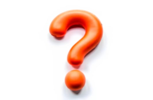 A vibrant orange question mark highlights uncertainty and challenges in finding solutions to problems and misunderstandings.. Blurred picture