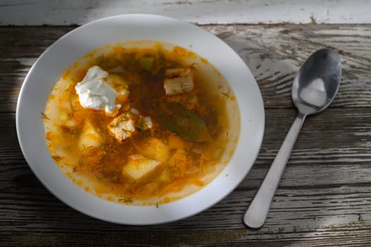 Hearty stew combines tender meat, potatoes, and herbs in a rustic setting, perfect for a cozy autumn meal.
