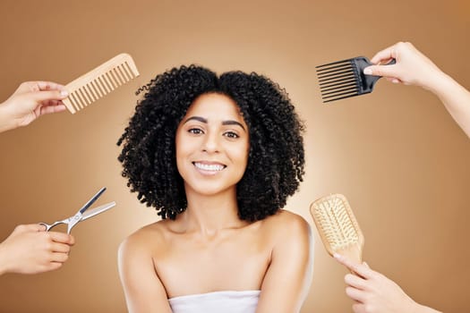 Hair care, brush and portrait of woman in a studio with curly, natural and salon treatment. Smile, beauty and female model from Mexico with comb for healthy hairstyle isolated by brown background