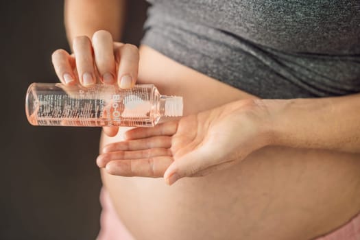 Turkiye, Antalya 02.02.2022: Woman holds Bio Oil, a nurturing choice for pregnant women. A soothing image of care and wellness during pregnancy.