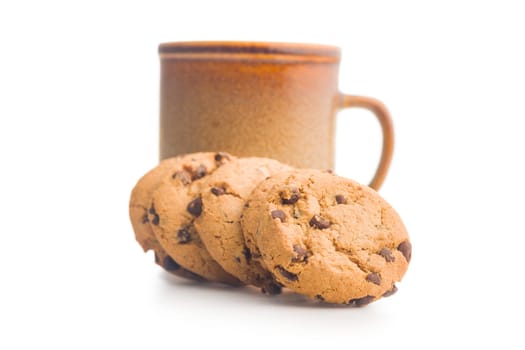 Chocolate chip cookies and mug  isolated on a white background.