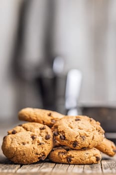 Chocolate chip cookies on a wooden table.