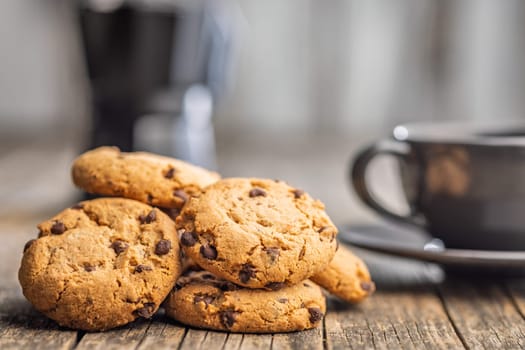 Chocolate chip cookies on a wooden table.