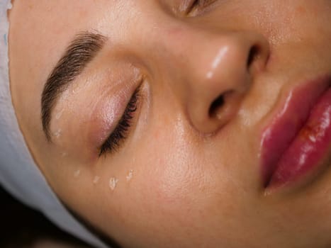 Anti-wrinkle moisturizing gel for the face around the eyes for the eyelids. Women's care at a beautician, close-up