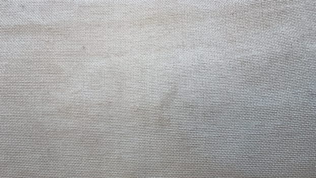 Light-colored fabric is emphasized, showcasing its fine weave and soft texture.