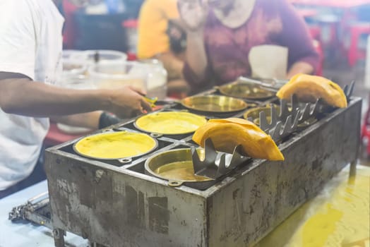 Apam Balik or Apom Balik traditional Malaysian pancake in Jalar Alor street food in Kuala Lumpur