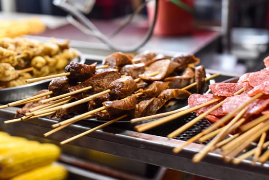 Grilled sausages and salami bbq in Jalan Alor street food in Kuala Lumpur