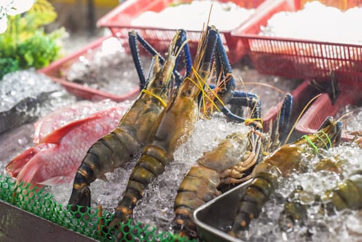 Raw shrimps in ice in the Jalan Alor street food in Kuala Lumpur