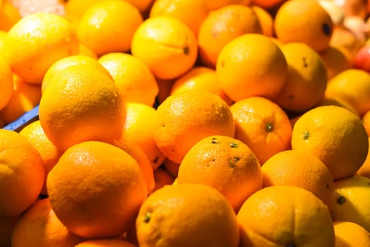 Many oranges in the night market of a street food in Malaysia