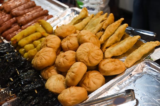 Vietnamese pies with meat and onion on a night market in food festival