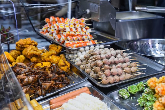 Many snacks and seafood in vietnamese night market in food festival