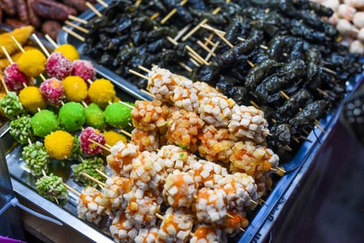 Many snacks and seafood in vietnamese night market in food festival