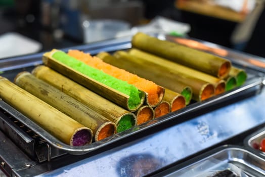 Colorful sticky rice in bamboo in vietnamese night market