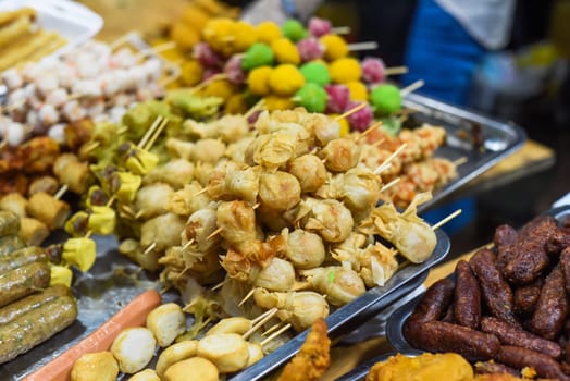 Many snacks and seafood in vietnamese night market in food festival