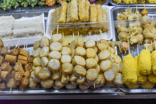 Many snacks and seafood in vietnamese night market in food festival