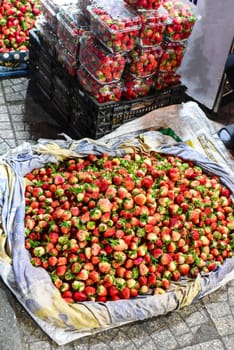 Many fresh natural strawberry in vietnamese night market in Da Lat
