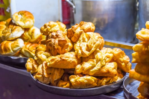 eclair pastries with custard cream in night market of street food in Da Lat in Vietnam