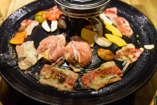 Traditional korean bbq with chicken, beef and vegetables