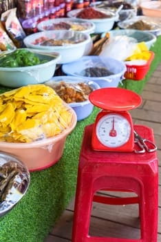 scales in the Vietnamese market for weighing dried fruits and snacks