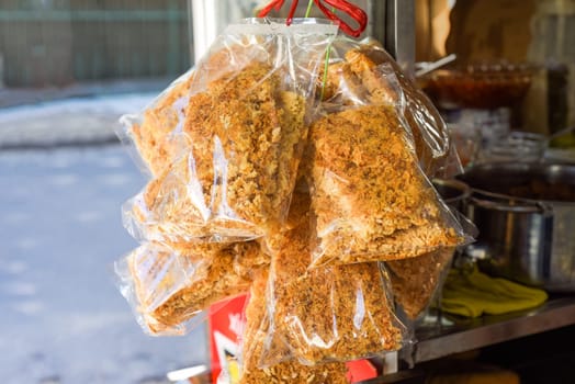 Vietnamese traditional Com Chay made of rice and with Rousong (meat floss with eggs and fish sauce) on street food in Nha Trang