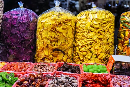 Many dried fruits and berries in night market of street food in Da Lat in Vietnam