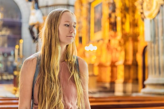Female tourist exploring the Metropolitan Cathedral in Mexico City. Woman admiring the architecture and history of Mexico's iconic landmark. Concept of cultural heritage, religious tourism, and travel discovery.
