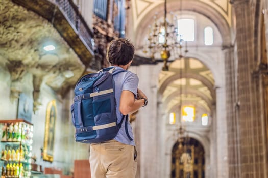 Male tourist exploring the Metropolitan Cathedral in Mexico City. Woman admiring the architecture and history of Mexico's iconic landmark. Concept of cultural heritage, religious tourism, and travel discovery.