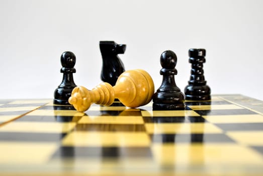 The black pawn defeated white queen on the chessboard