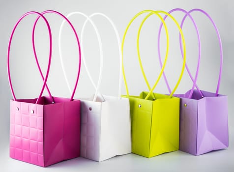 Plym package bags for flowers made of corrugated cardboard on white background