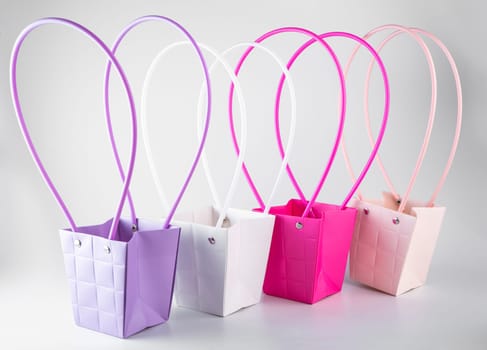 Plym package bags for flowers made of corrugated cardboard on white background