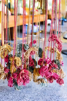 Many colorful prepared threads for weaving hammocks in vietnam