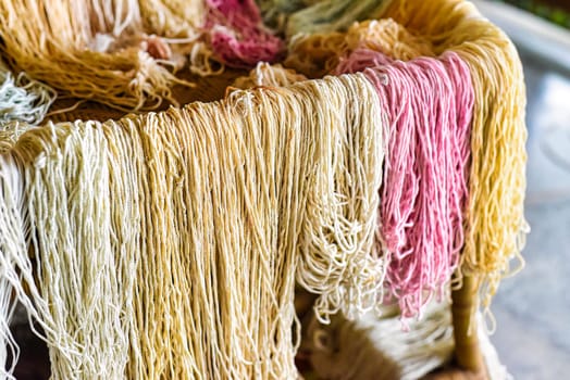 Many colorful prepared threads for weaving hammocks in vietnam