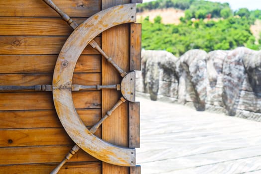 Wooden helm decoration on a gate door