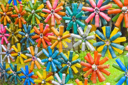 Flower shaped colourful decorations made of plastic bottles
