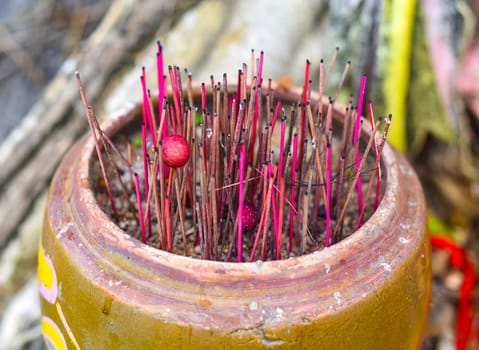 Senko candles smoldering in Vietnamese Buddhist temple