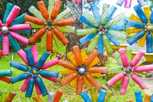 Flower shaped colourful decorations made of plastic bottles