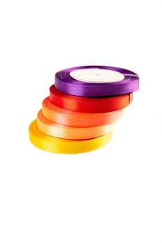 set of multi-colored satin ribbons for gifts on white background