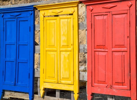 Bright colorful wooden doors made like a fence